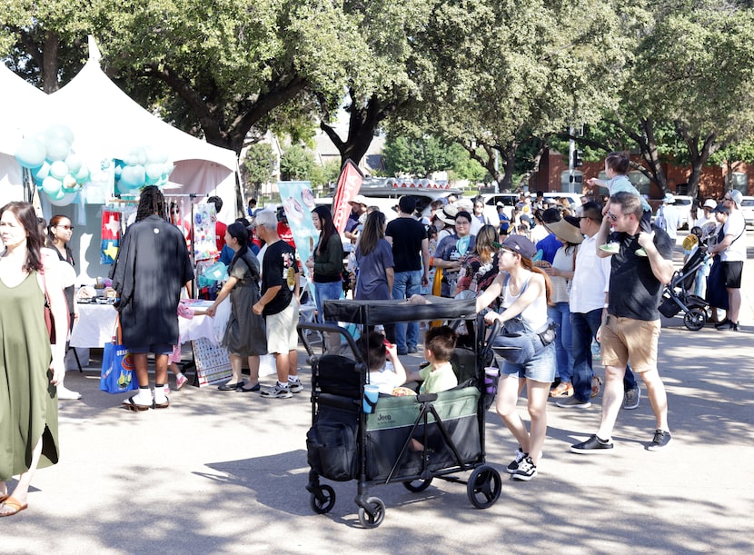 Guests visit various booths during the Dallas Japanese Association's annual Akimatsuri...