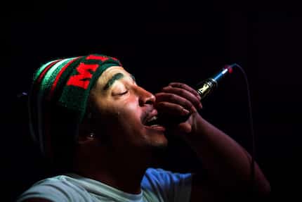 Demetrius Morris, who goes by "Meechie Flame,"  raps on stage during a weekly hip-hop night...