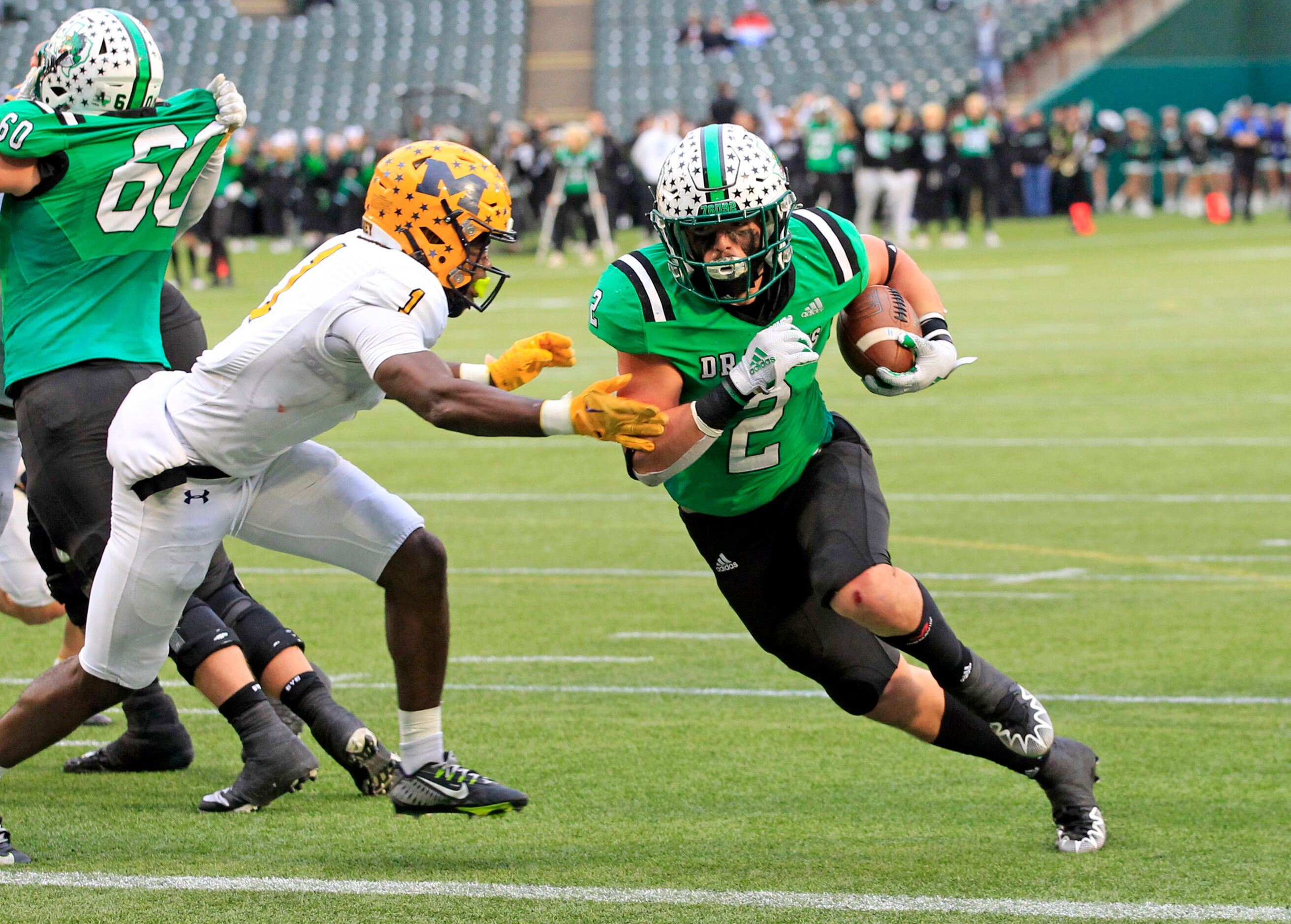 Southlake’s Owen Allen (2) blows by McKinney’s Makhi Frazier (1) in route to a touchdown...