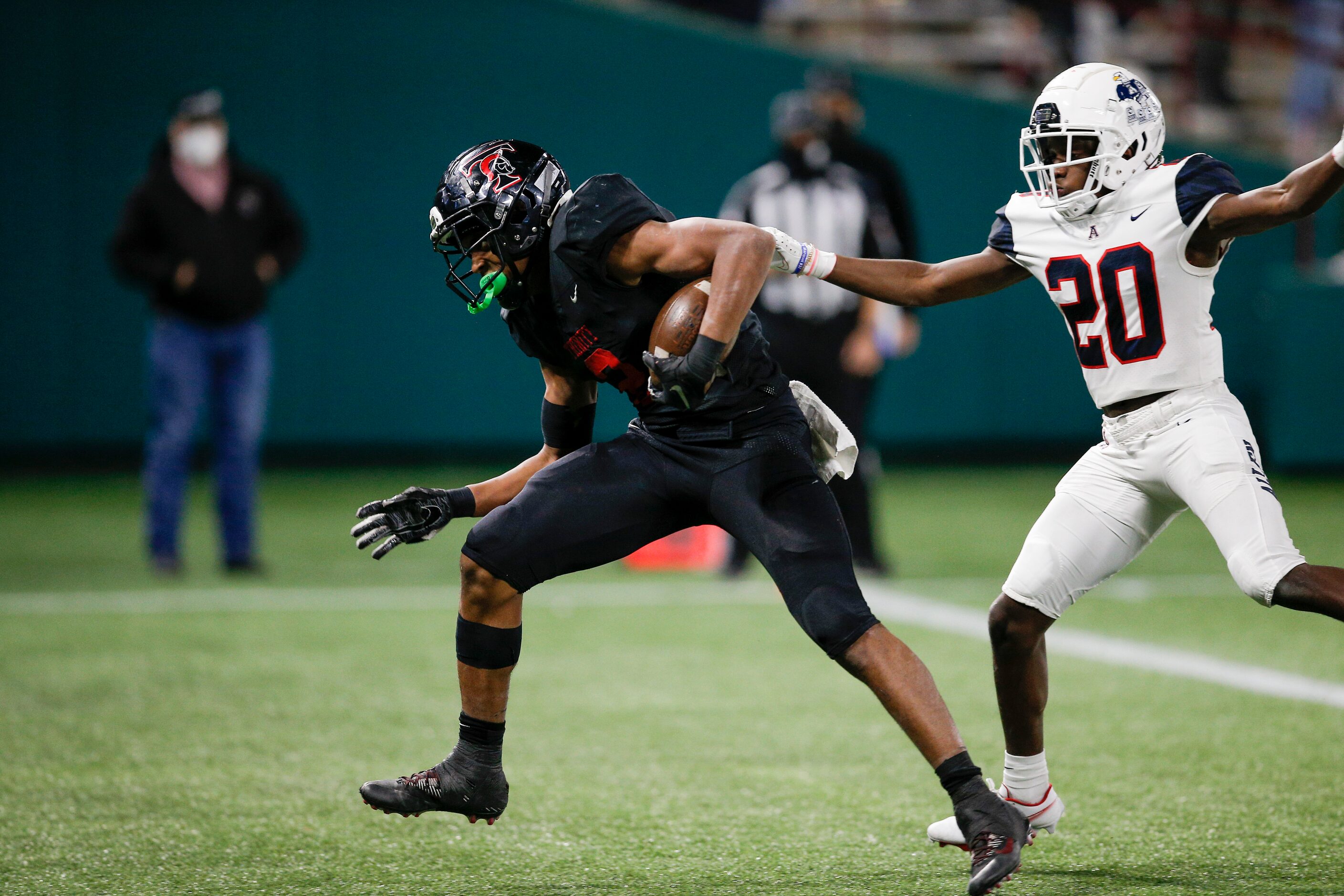 Euless Trinity junior running back Ollie Gordon (2) breaks past Allen junior defense back...