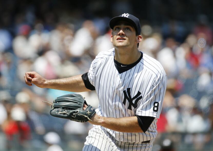 New York Yankees starting pitcher Nathan Eovaldi (30) reacts as he watches Danny Santana's...