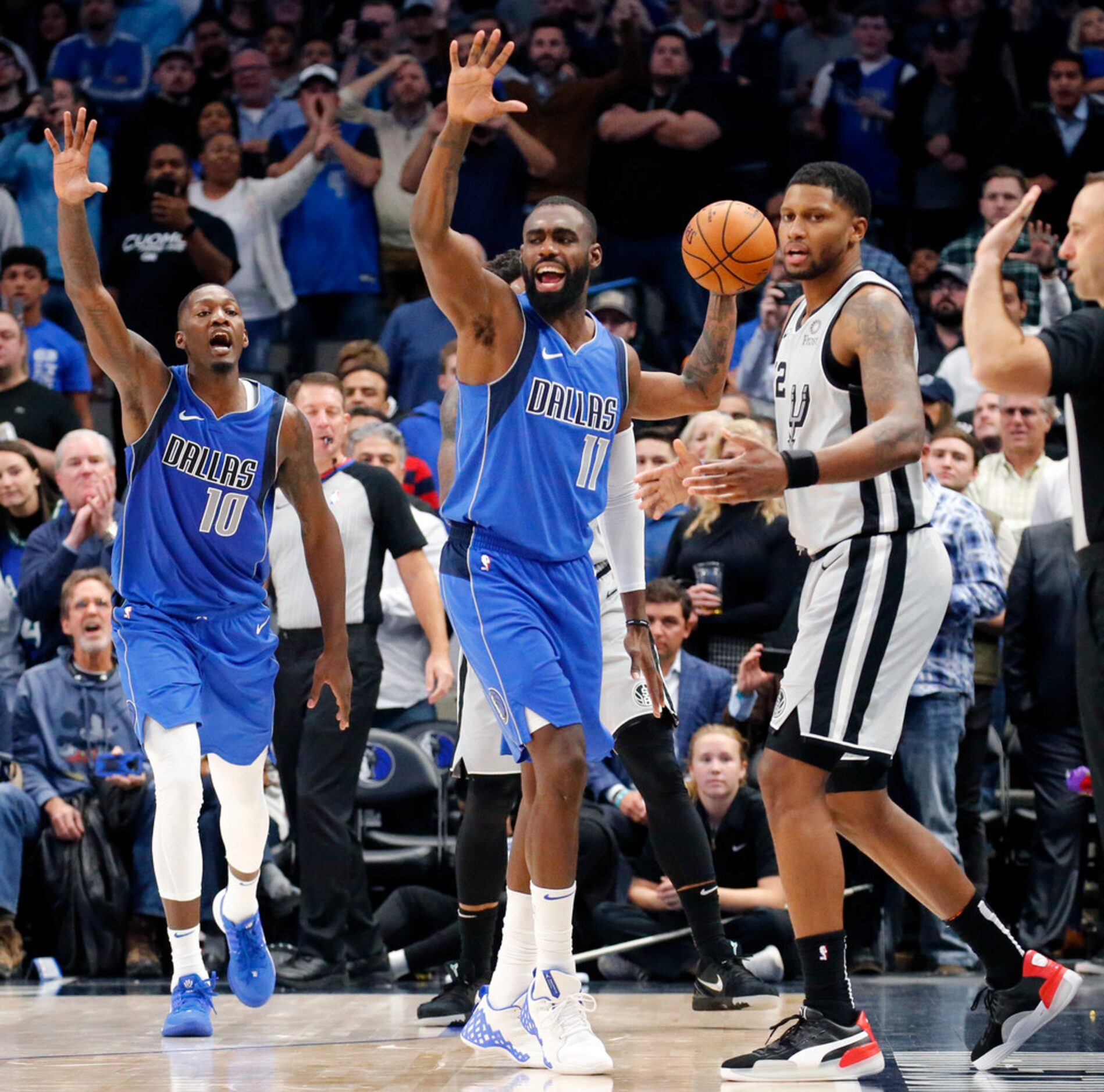 Dallas Mavericks guard Tim Hardaway Jr. (11) and forward Dorian Finney-Smith (10) exhault...