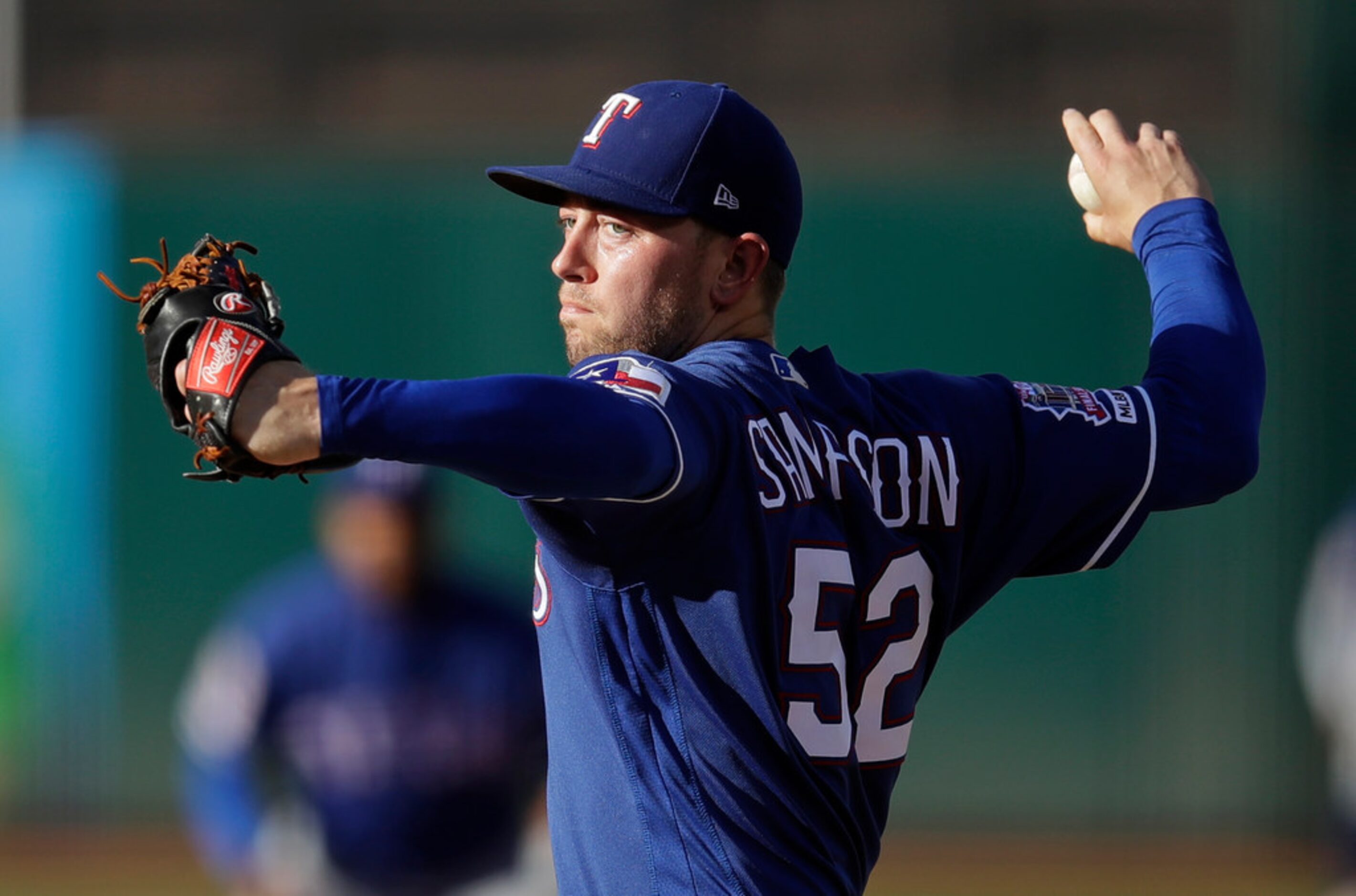 Texas Rangers pitcher Adrian Sampson works against the Oakland Athletics in the first inning...