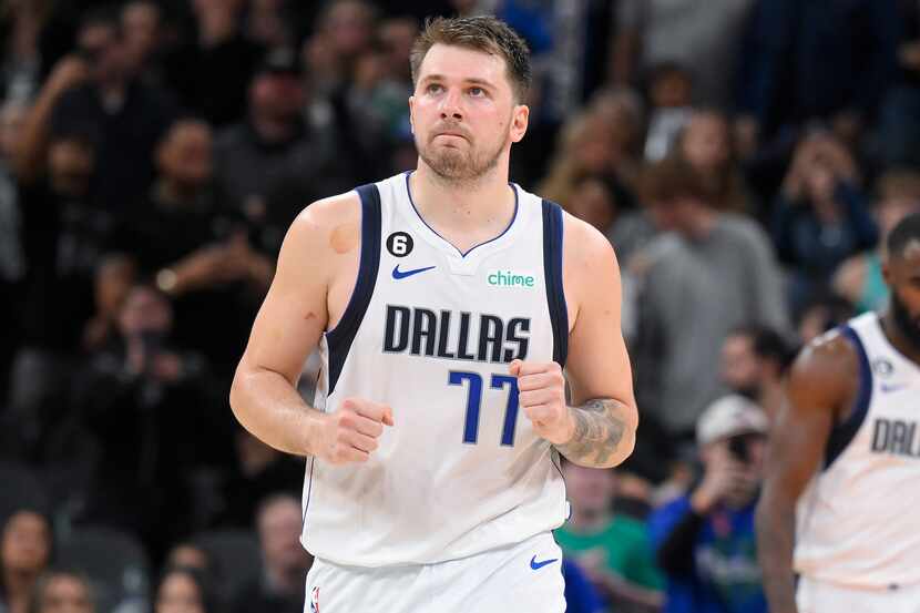 Dallas Mavericks' Luka Doncic celebrates after making a free throw during the second half of...