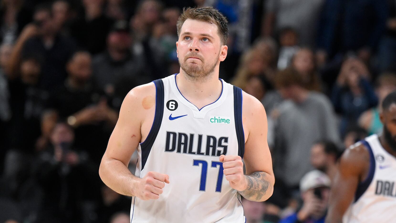 Dallas Mavericks' Luka Doncic celebrates after making a free throw during the second half of...