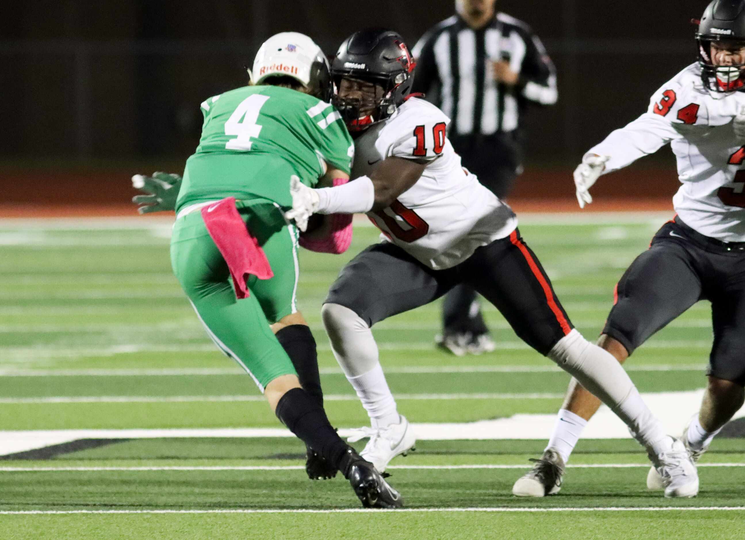 Frisco Liberty linebacker Collin Maye (10) tackles Lake Dallas quarterback Trevor Moon (4)...