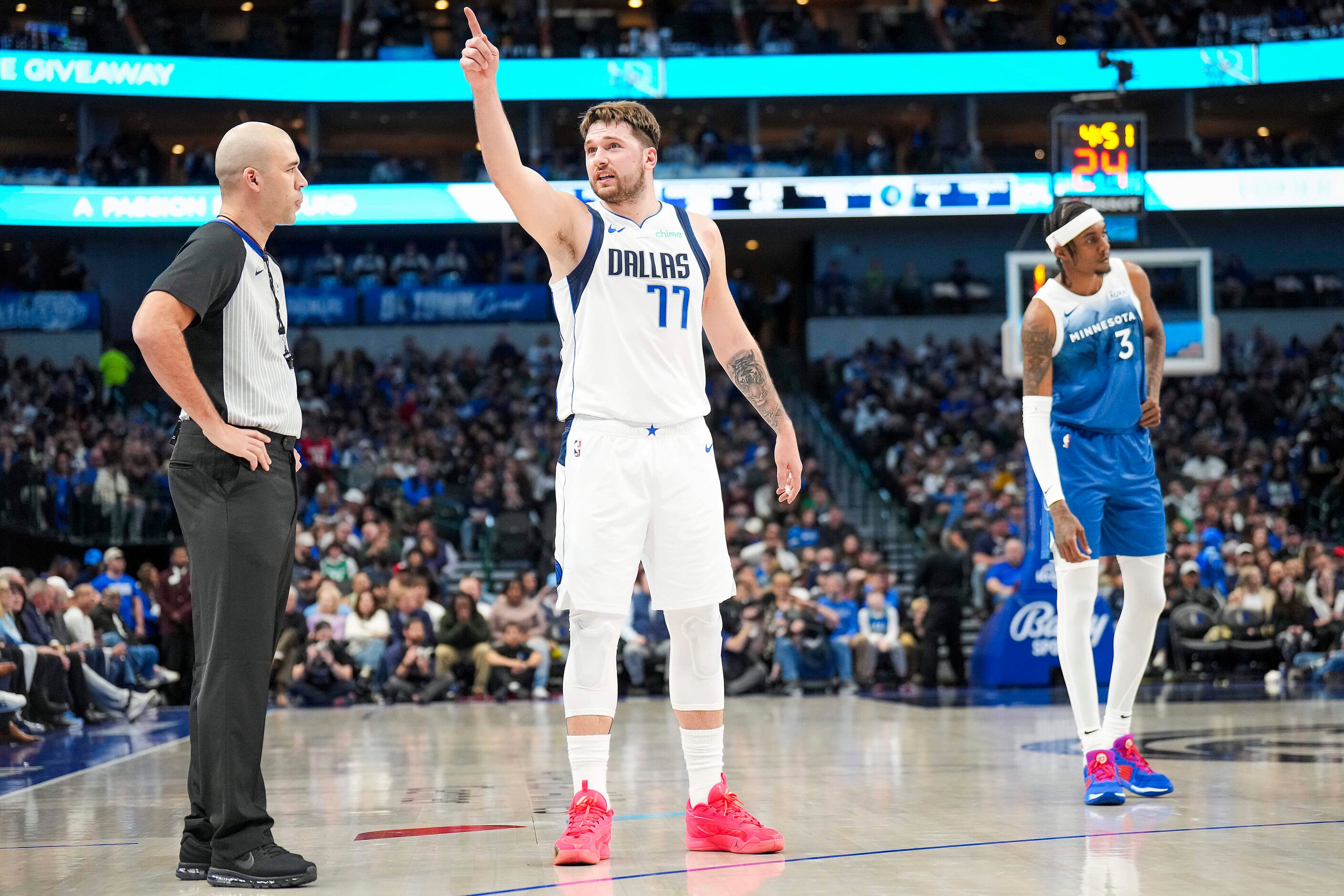 Dallas Mavericks guard Luka Doncic (77) argues for a call during the first half of an NBA...