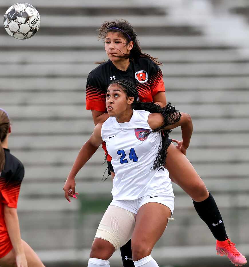 Duncanville Halle Garcia (24) and Rockwall Mia Nunez go for a loose ball during the first...