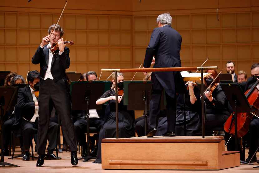 Violinist James Ehnes (leaping, left) performs Elgar's Violin Concerto with the Dallas...