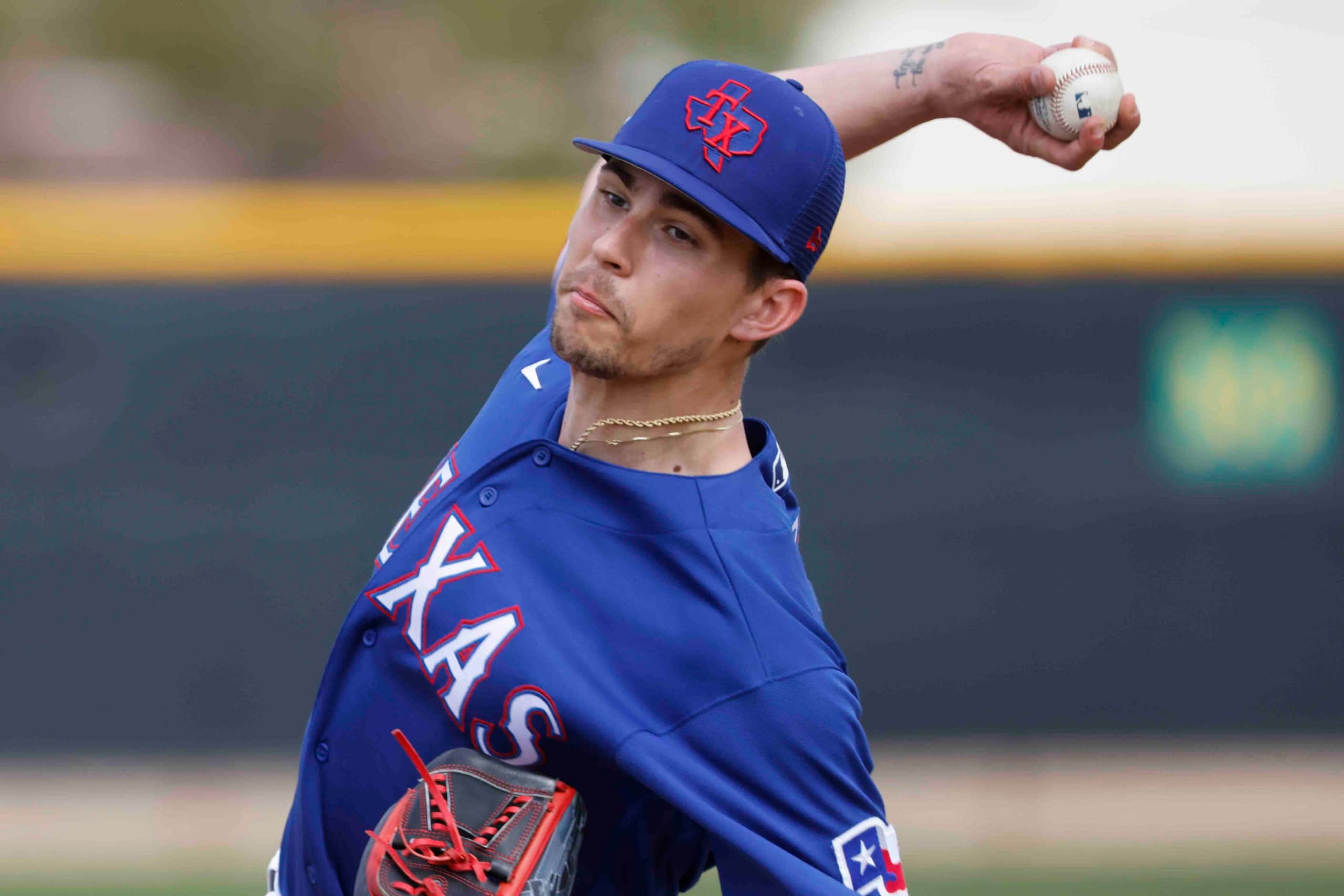 Texas Rangers pitcher Ricky Vanasco pitches during a spring training workout at the team's...