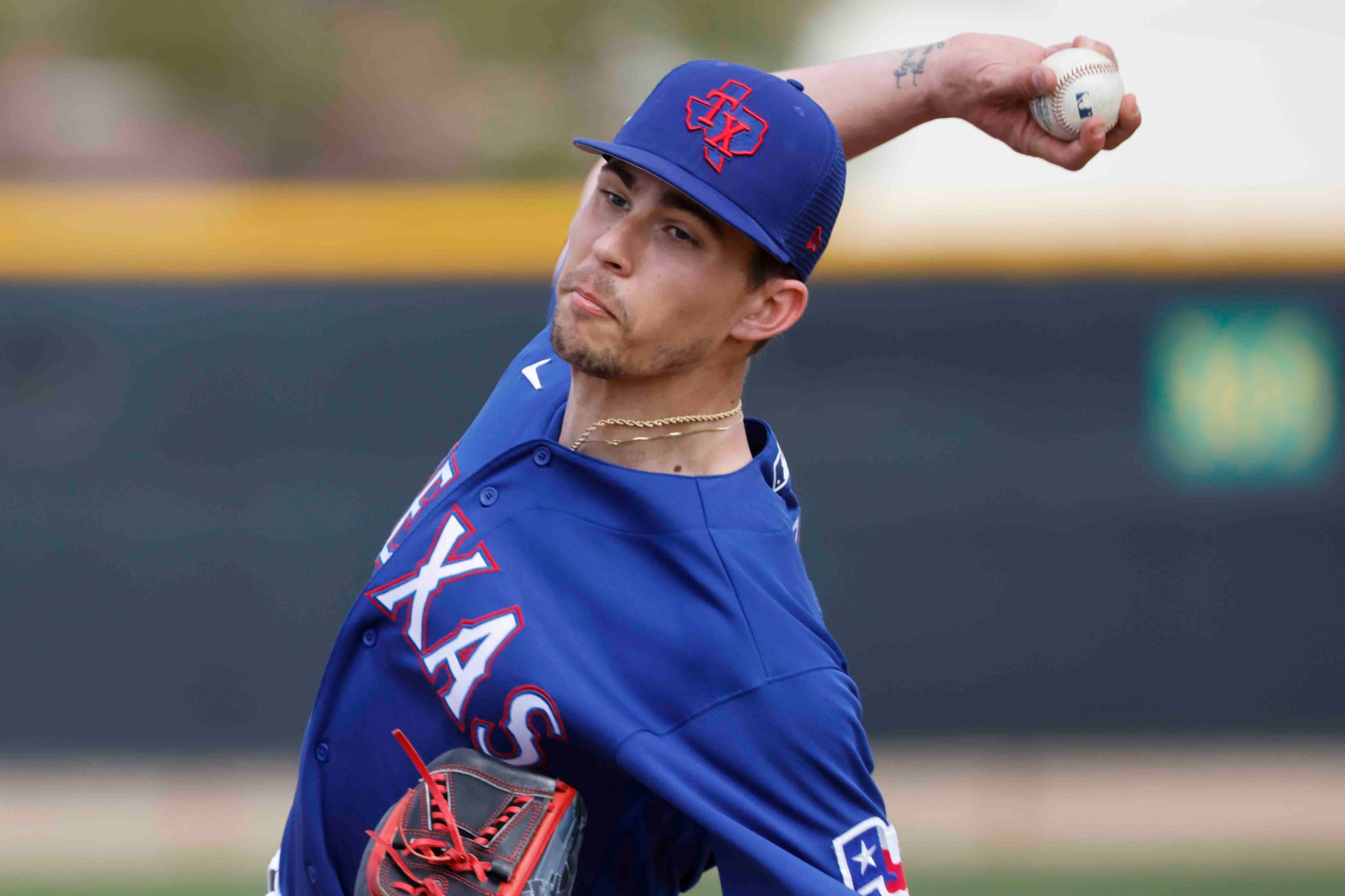 Texas Rangers pitcher Ricky Vanasco pitches during a spring training workout at the team's...