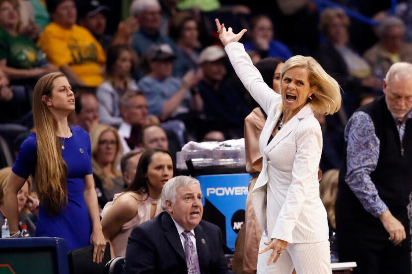 Baylor head coach Kim Mulkey motivates fans during the second half of a regional semifinal...