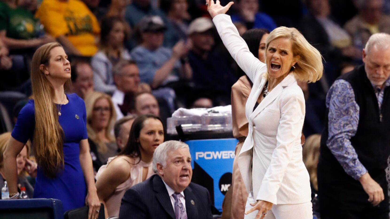 Baylor head coach Kim Mulkey motivates fans during the second half of a regional semifinal...