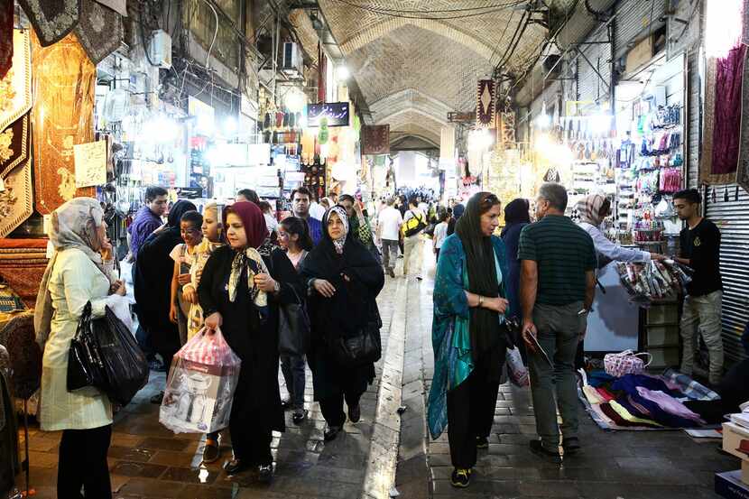 People walk at the old main bazaar in Tehran, Iran, July 23, 2018. Iranians shrugged off the...