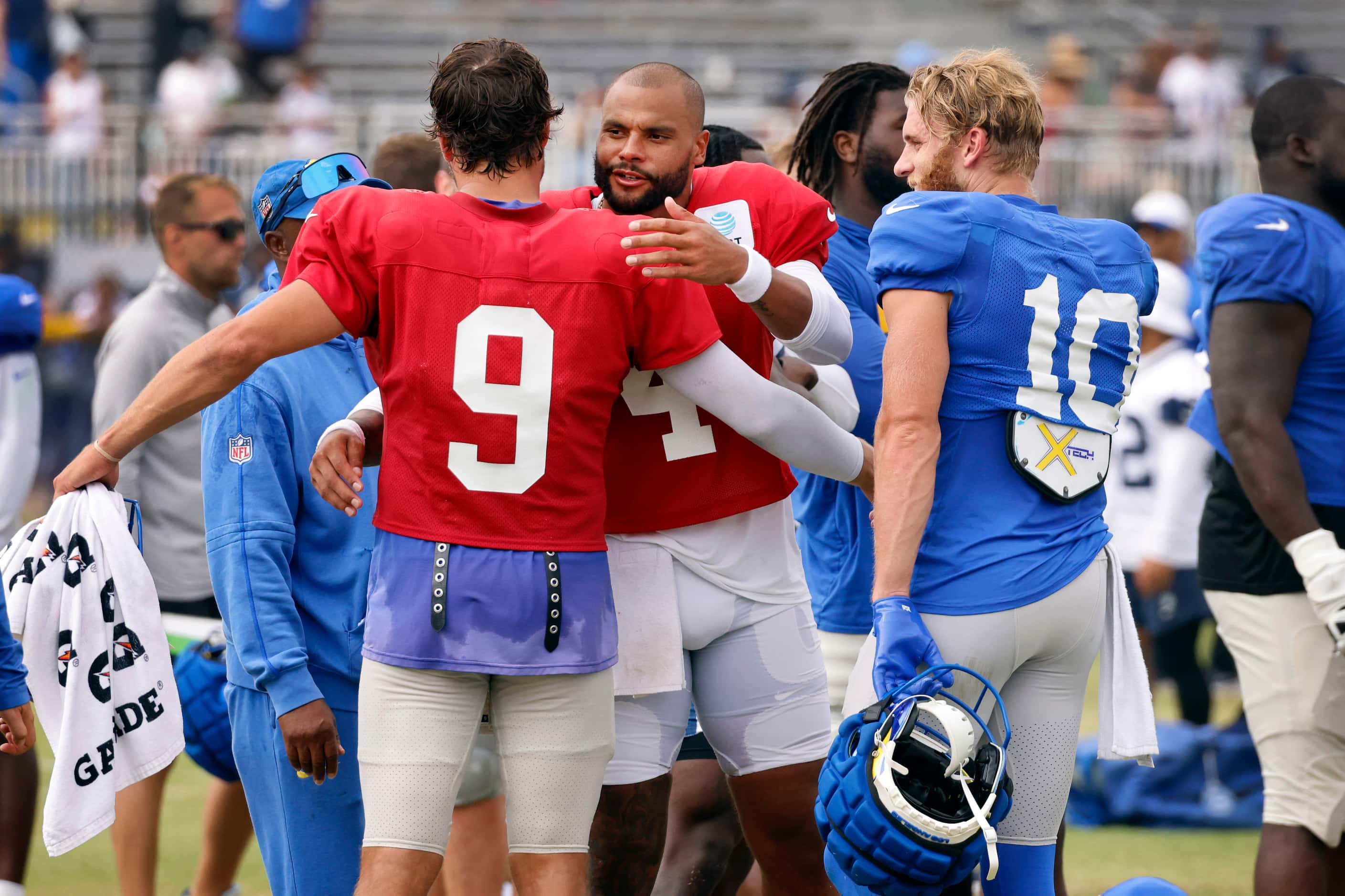 Dallas Cowboys quarterback Dak Prescott (4) gives Los Angeles Rams quarterback Matthew...