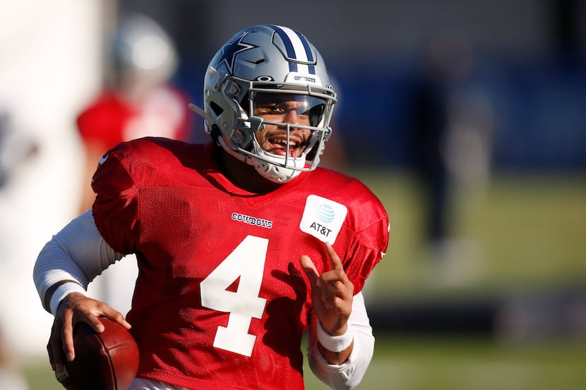 Dallas Cowboys quarterback Dak Prescott (4) runs up the field after the catch during...