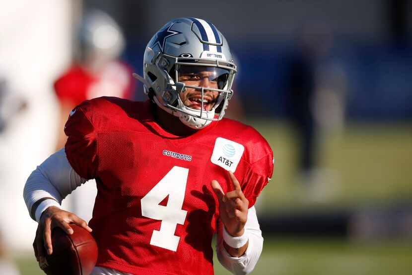 Dallas Cowboys quarterback Dak Prescott (4) runs up the field after the catch during...