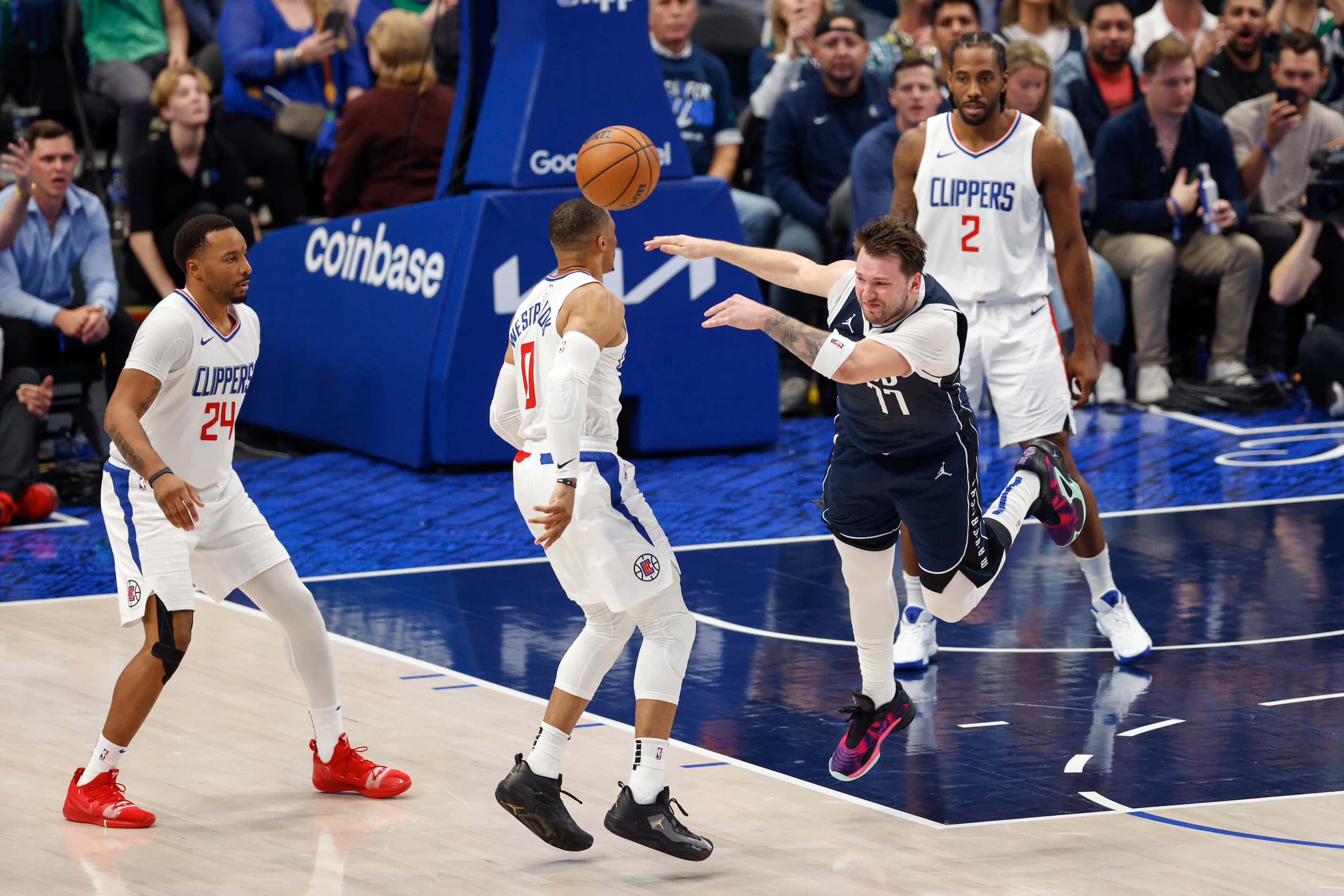 Dallas Mavericks guard Luka Doncic (77) reacts after being fouled by LA Clippers guard...