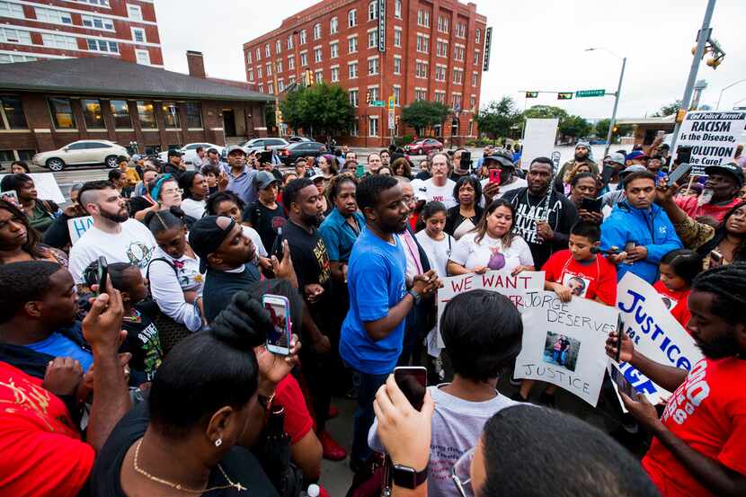 Dominique Alexander talks to protesters during a protest in regards to the shooting of...