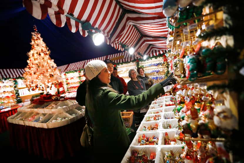 Shoppers check out ornaments made by Käthe Wohlfahrt during the Texas Christkindl Market in...