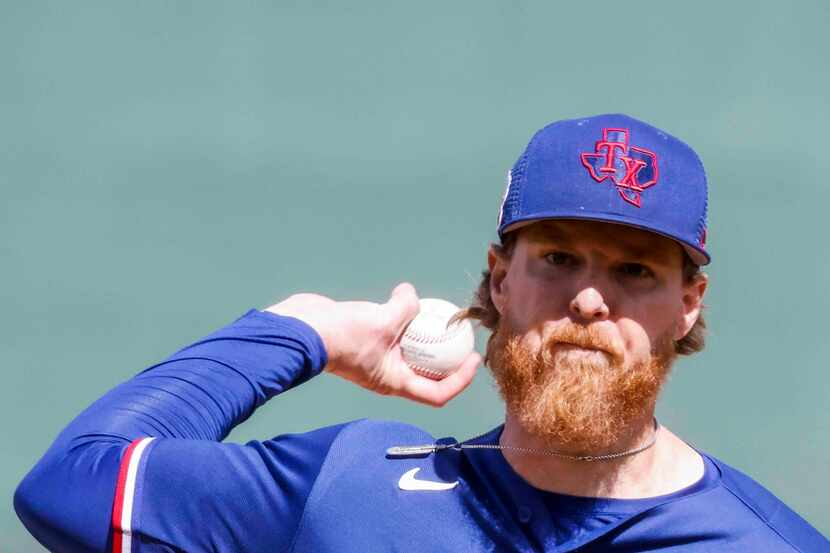 Texas Rangers pitcher Jon Gray delivers during the second inning of a spring training game...