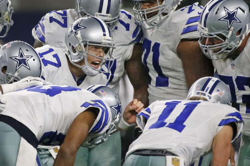 Dallas Cowboys quarterback Kellen Moore (17) calls the play in the huddle during the New...