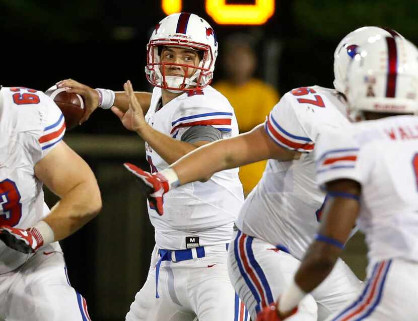 SMU quarterback Ben Hicks throws in the second quarter of an NCAA college football game...