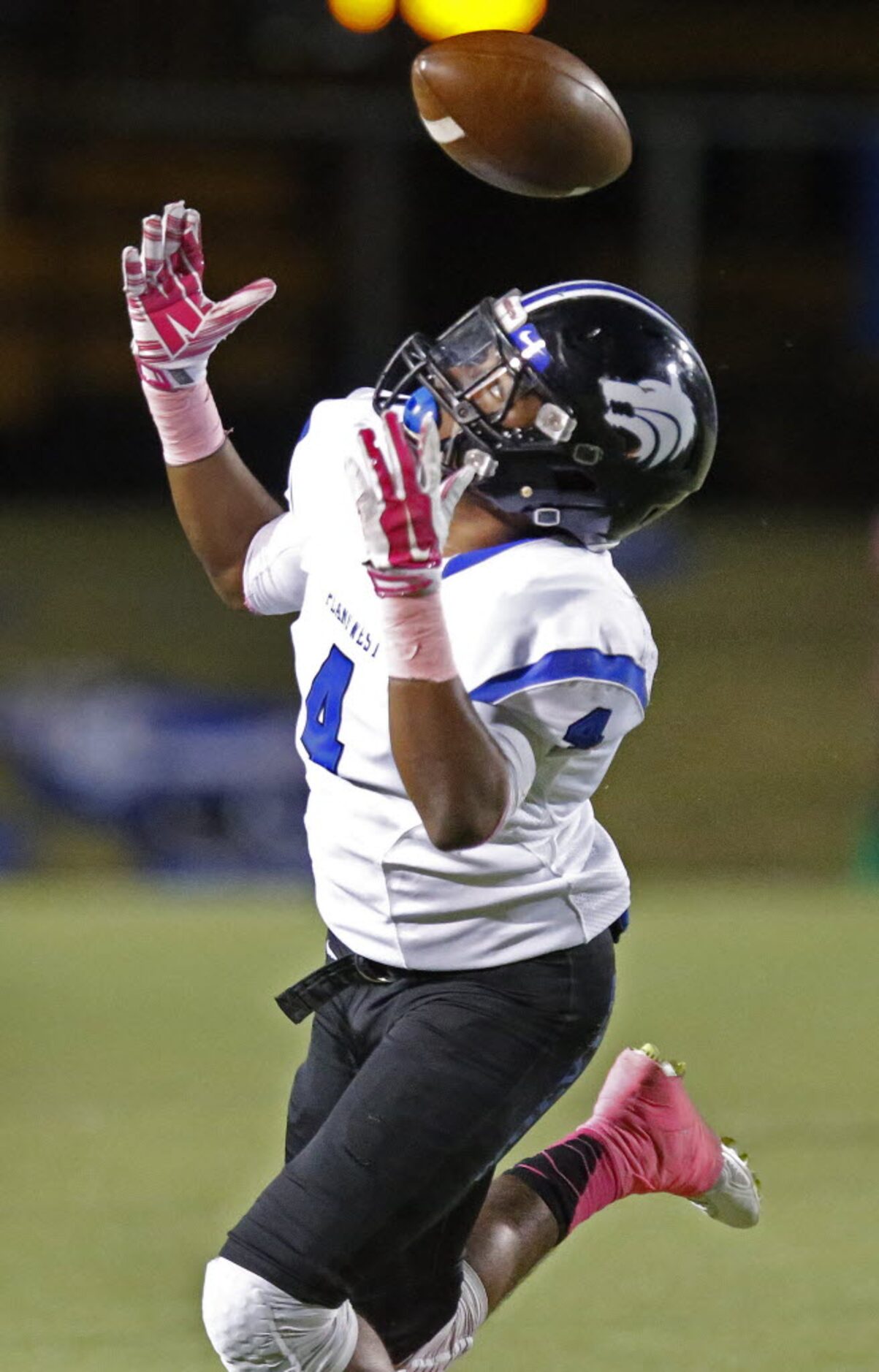 Plano West High School running back Tyler Campbell (4) was unable to find the handle on this...