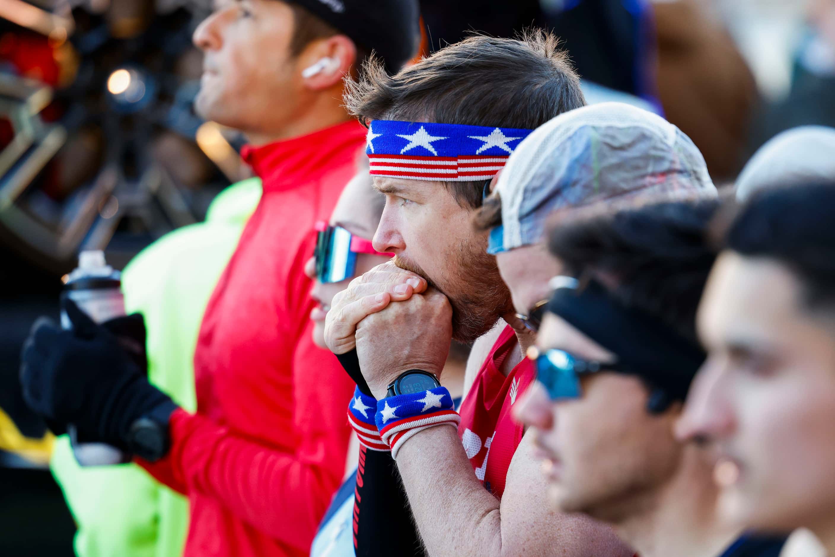 A runner embraces the cold as he alongside others wait at the starting line during 2023 BMW...