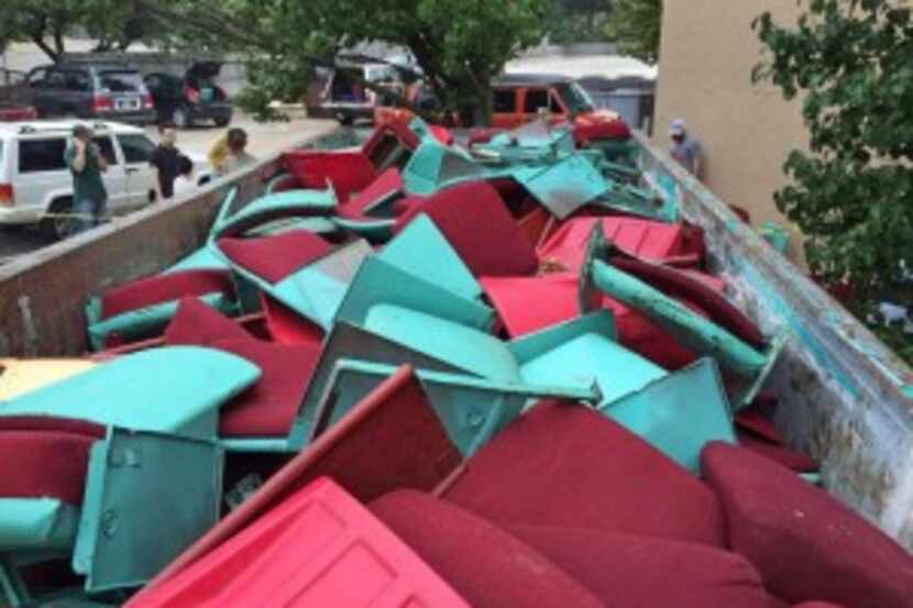  Seats removed from the 77-year-old Lakewood Theater sat in a dumpster Thursday, but not for...