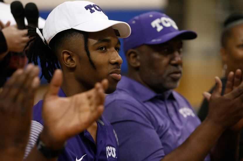 Midlothian basketball player Kaden Archie reacts after signing a national letter of intent...