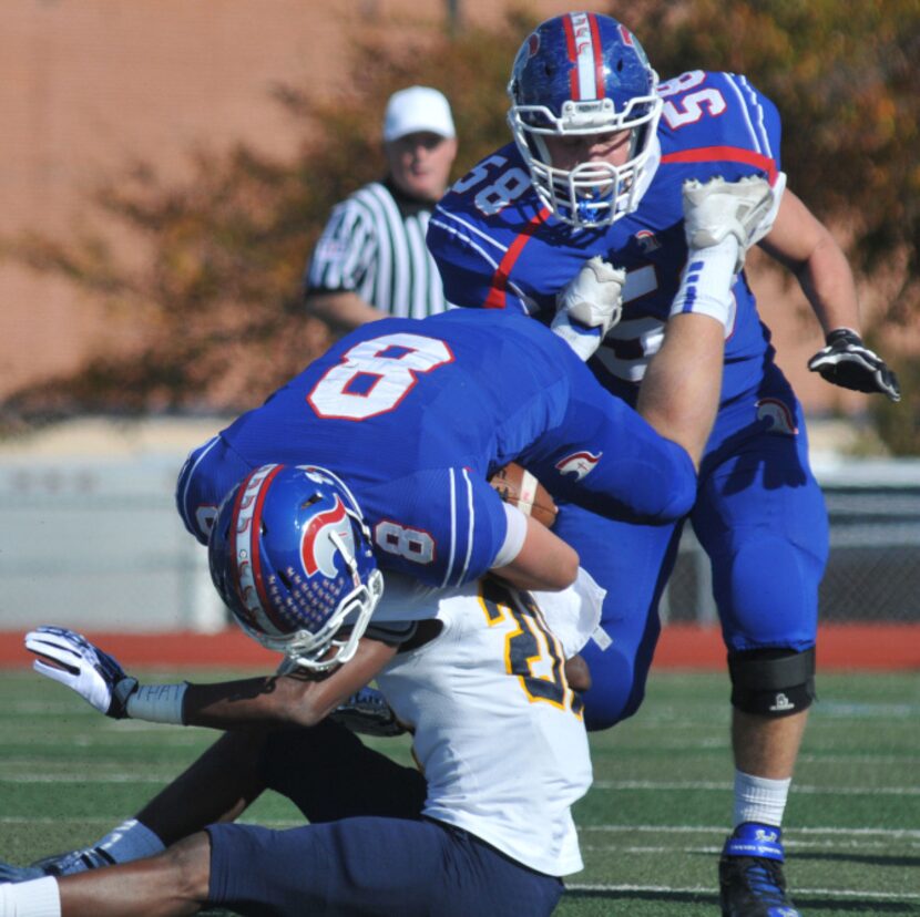 Prestonwood senior JR Reed (20) flips TCA - Addison junior quarterback Christian Hutzler (8)...