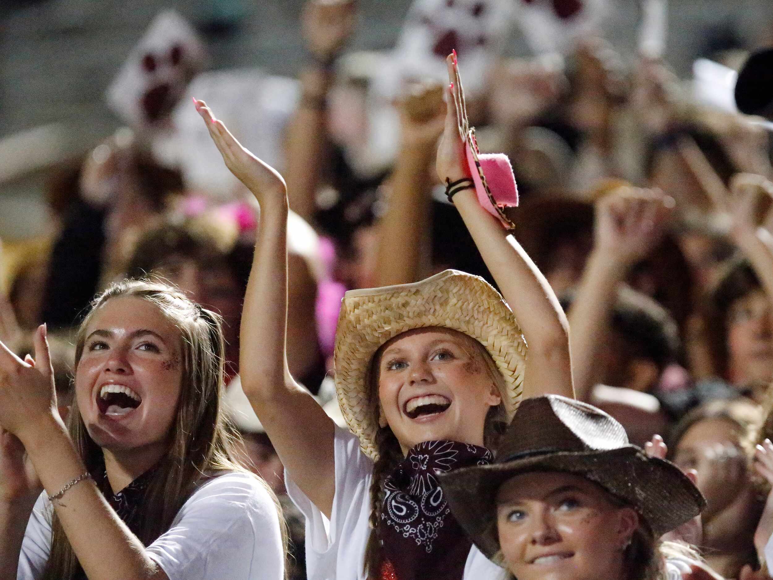 Plano Senior High School students cheer after a touchdown during the first half as Plano...