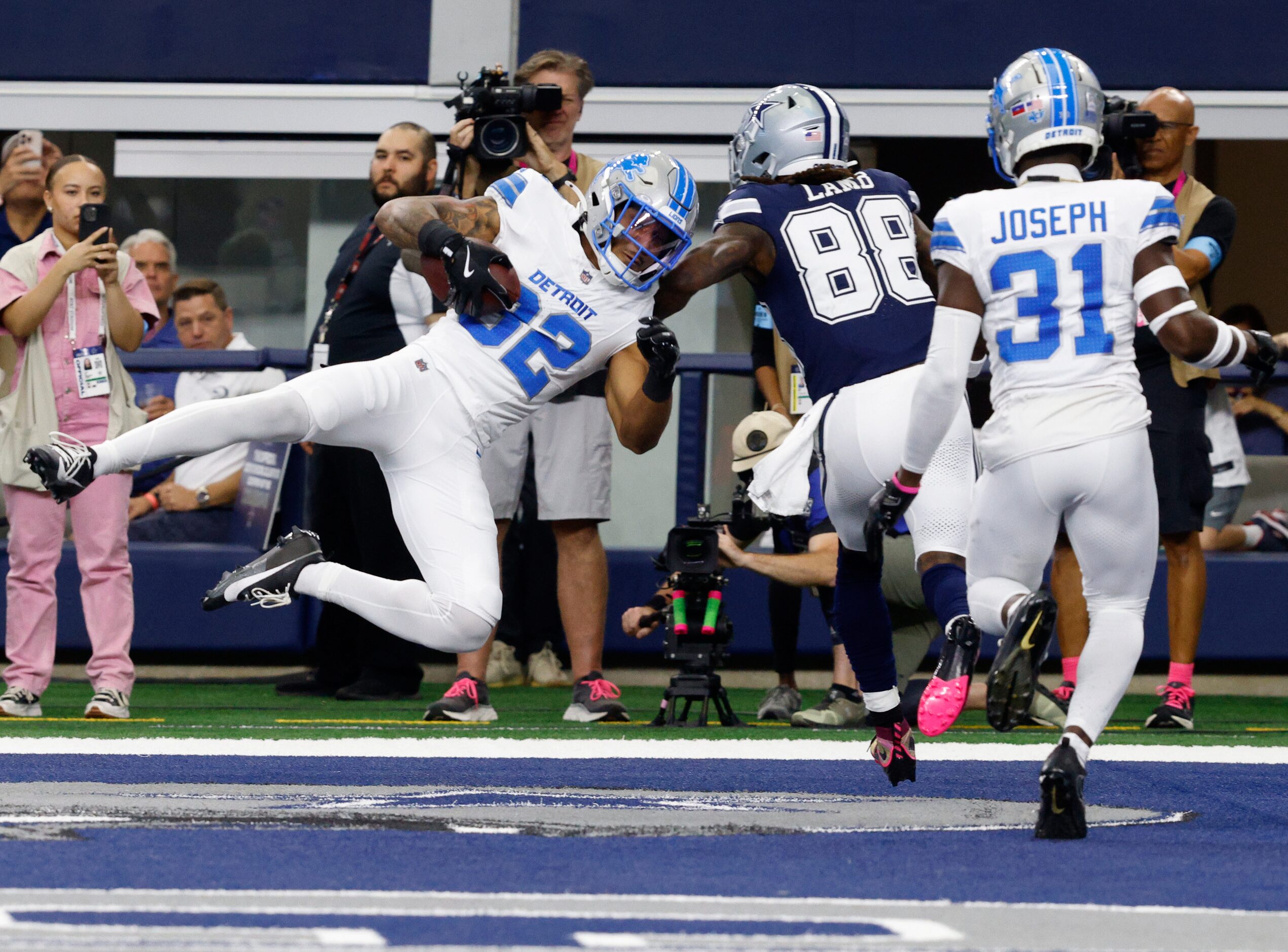 Detroit Lions safety Brian Branch (32) intercepts a pass intended for Dallas Cowboys wide...