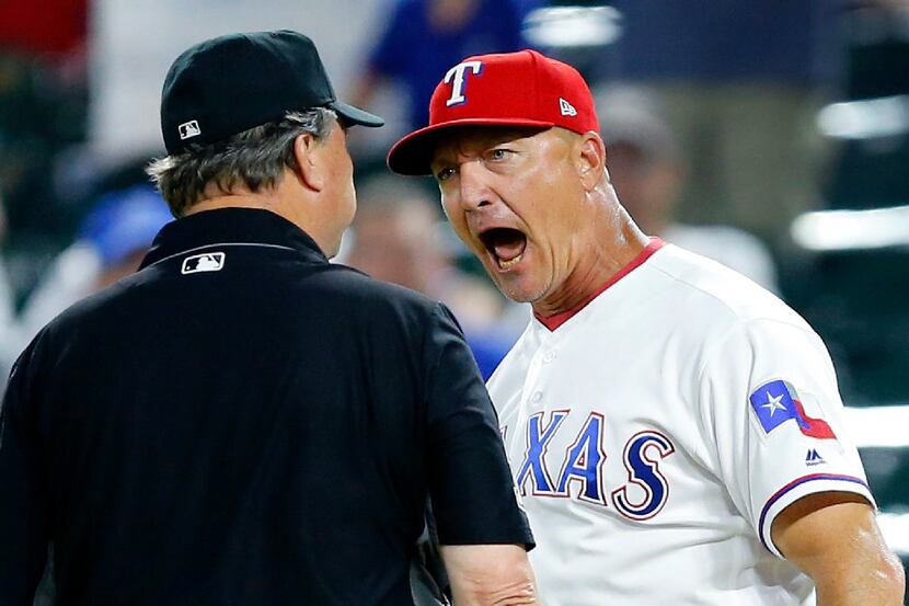 Texas Rangers manager Jeff Banister argues the ejection of Adrian Beltre by umpire Gerry...