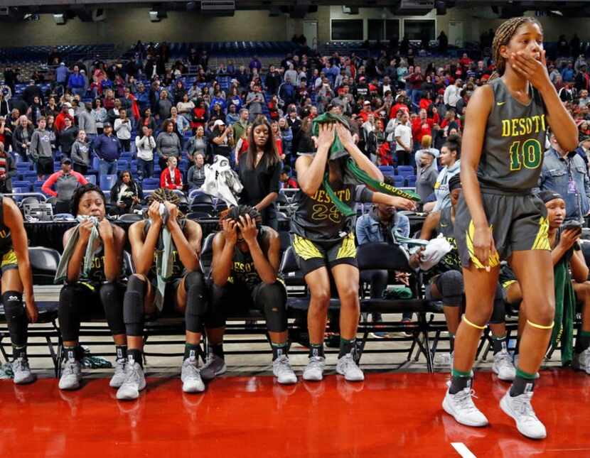 Desoto's Ayanna Thompson walks to the court as other members try hand a hard time. UIL girls...