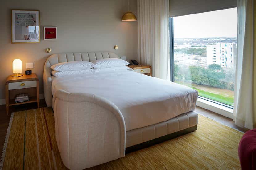 Each room has a "patented ergonomically designed bed with a channel-tufted headboard,"...