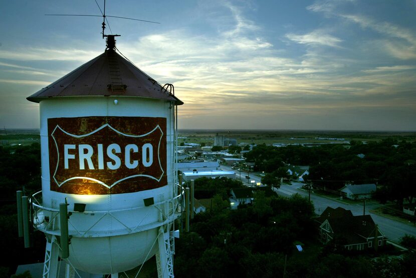 July 30, 2003 --The Frisco water tower looms over downtown at dusk as one of the city's most...