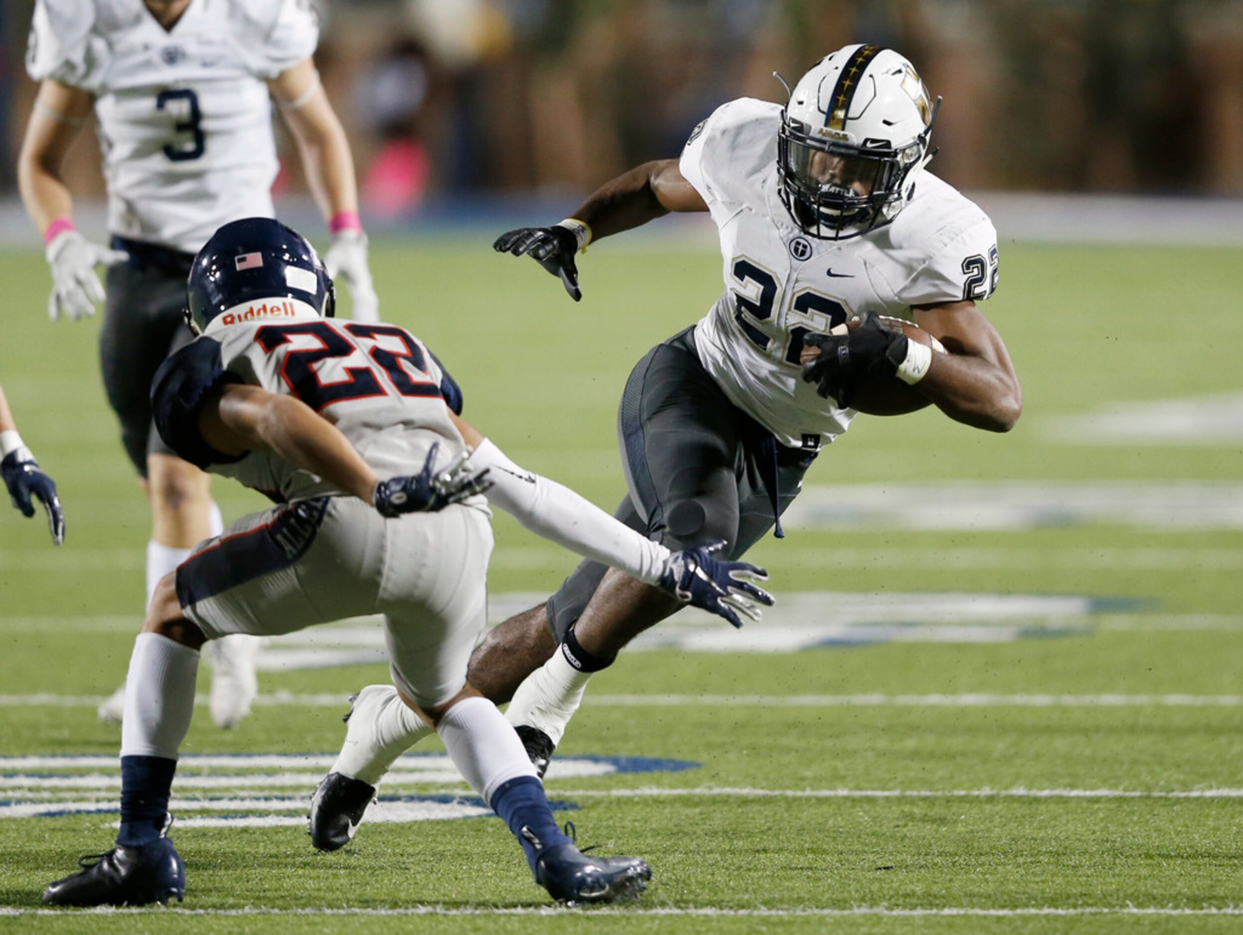 Jesuit's EJ Smith (22) breaks away from Allen's Cade Patton (22) on his way to score a...