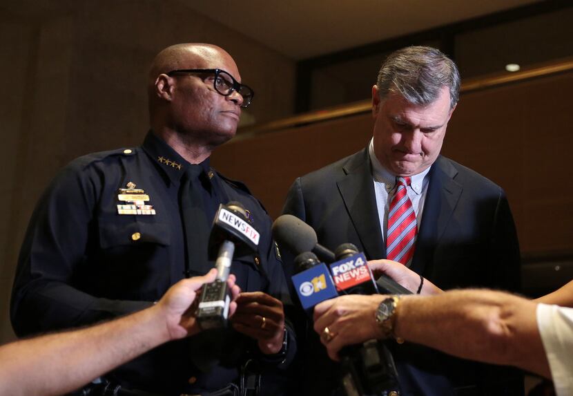 Dallas Police Chief David Brown and Mayor Mike Rawlings address the media at City following...