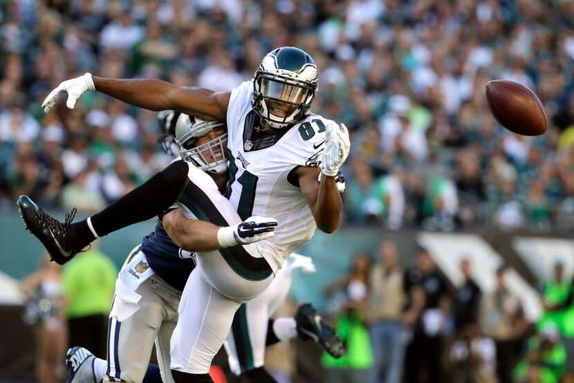 Philadelphia Eagles' Jordan Matthews, right, cannot catch a pass from Sam Bradford as he is...