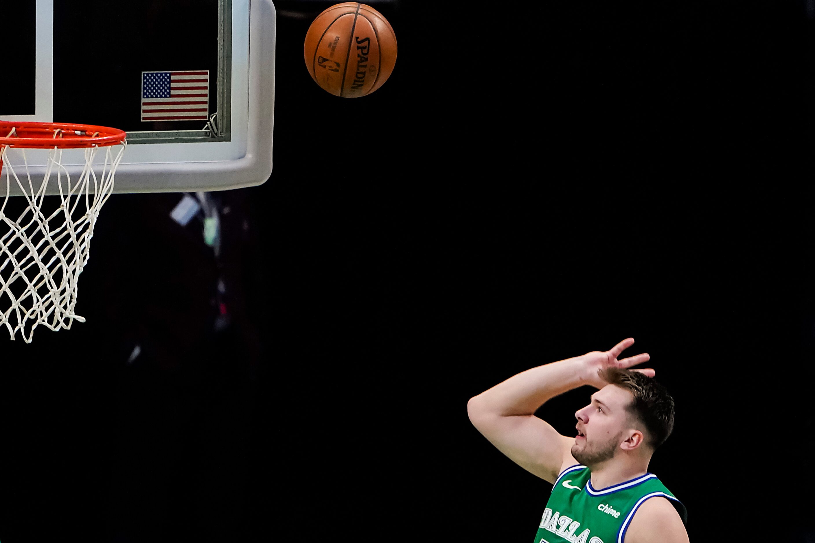 Dallas Mavericks guard Luka Doncic (77) puts up a shot during the first quarter of an NBA...