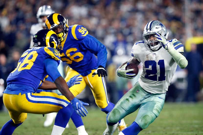 Dallas Cowboys running back Ezekiel Elliott (21) cuts back against Los Angeles Rams inside...