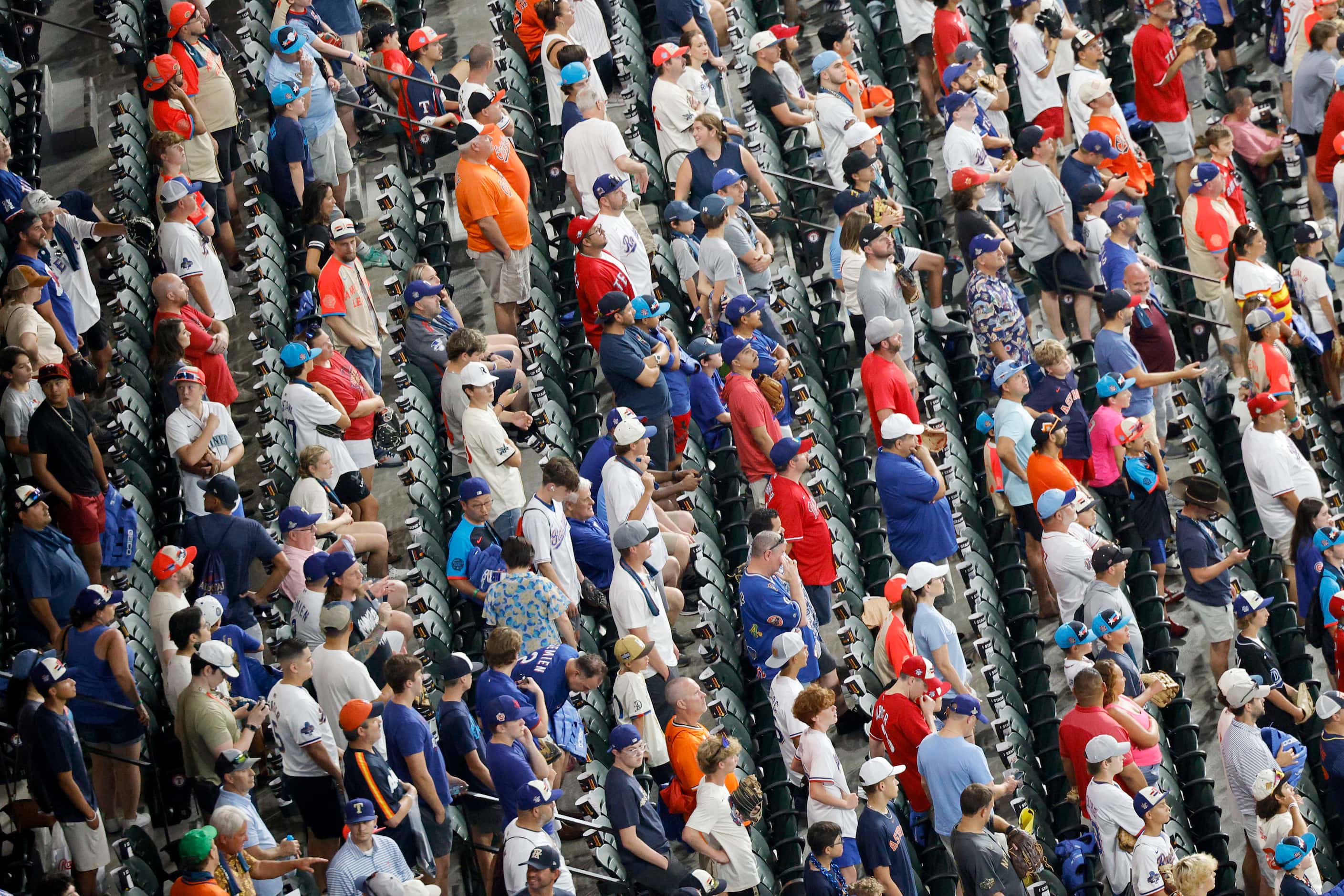 Fans watch a batting practice before  the MLB All-Star baseball game at Globe Life Field,...