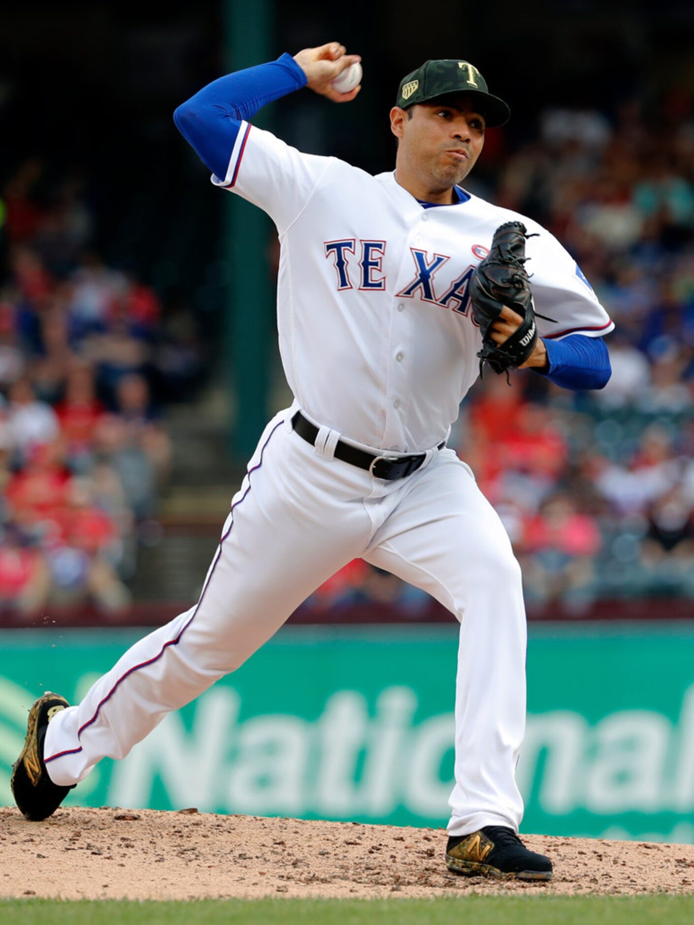 Texas Rangers relief pitcher Jeanmar Gomez throws to the St. Louis Cardinals in the fifth...