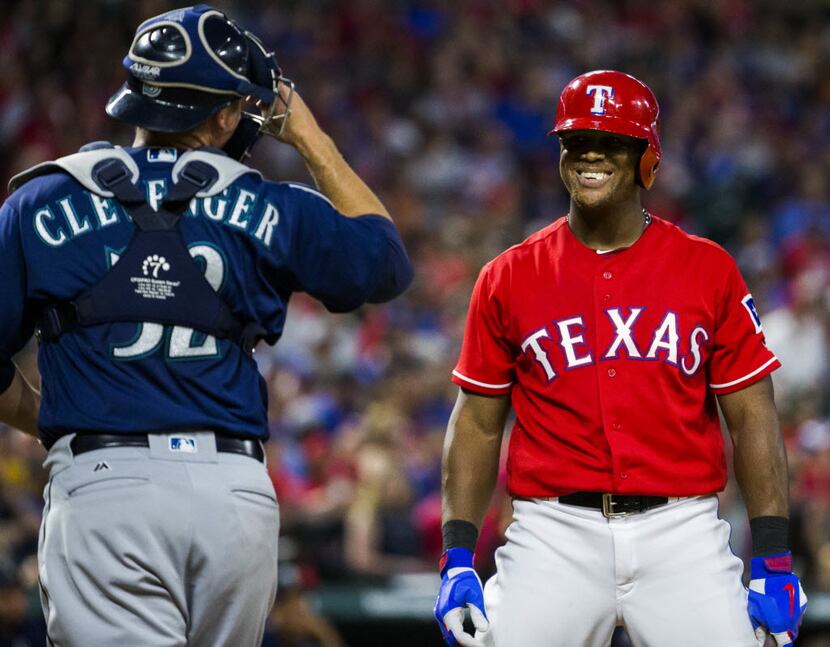 Texas Rangers third baseman Adrian Beltre (29) smiles at Seattle Mariners catcher Steve...