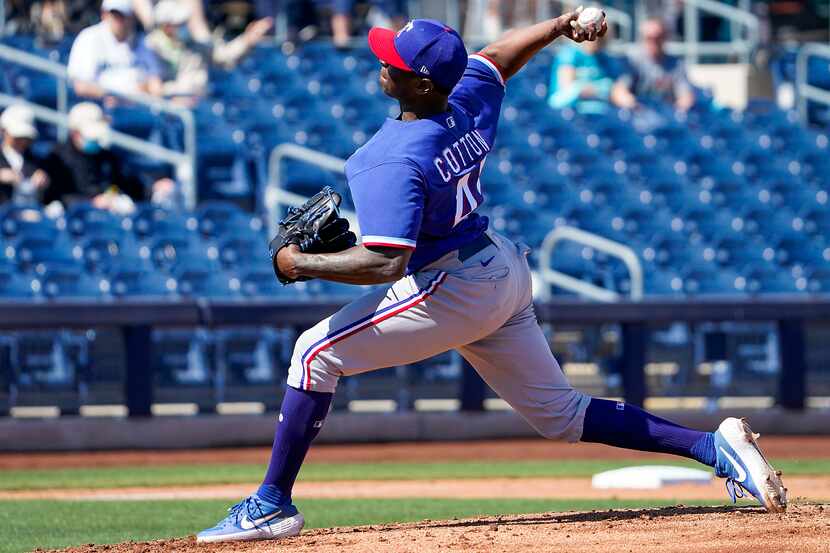 Texas Rangers pitcher Jharel Cotton delivers during the first inning of a spring training...
