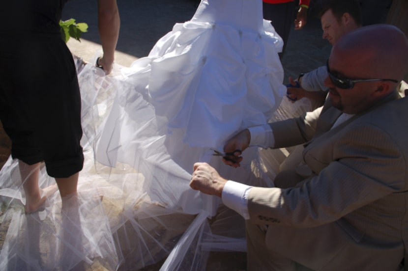 Cale Crisswell and friends take scissors to Ryane Criswell's dress after the reception so...