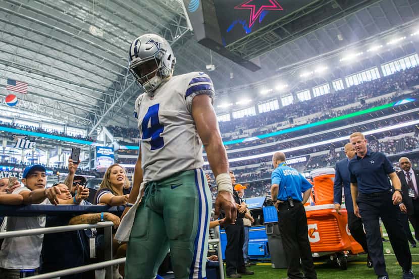 Dallas Cowboys quarterback Dak Prescott (4) leaves the field after a 35-30 loss to the Los...