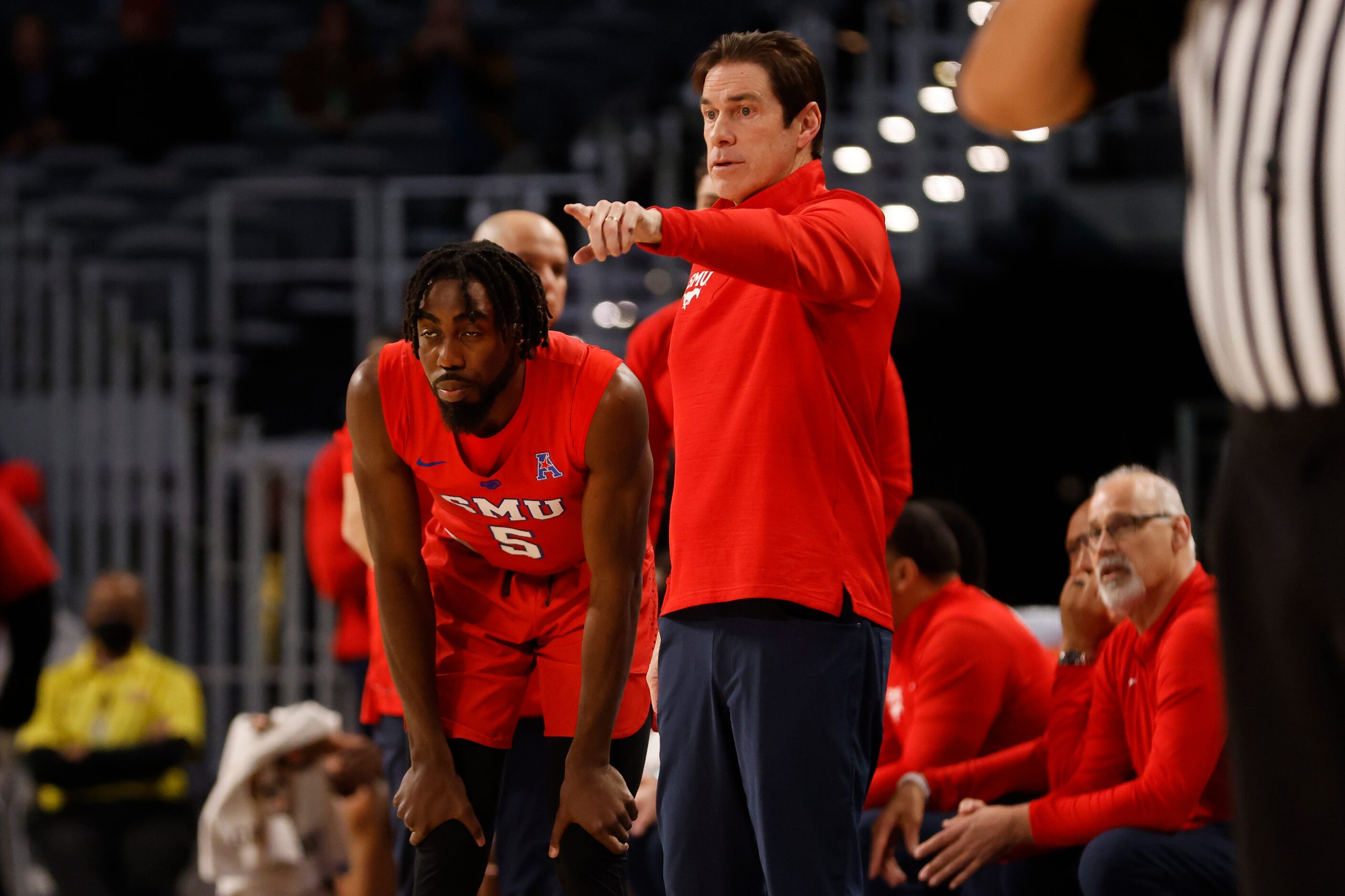 SMU head coach Tim Jankovich directs  guard Emmanuel Bandoumel (5) as they played Memphis,...